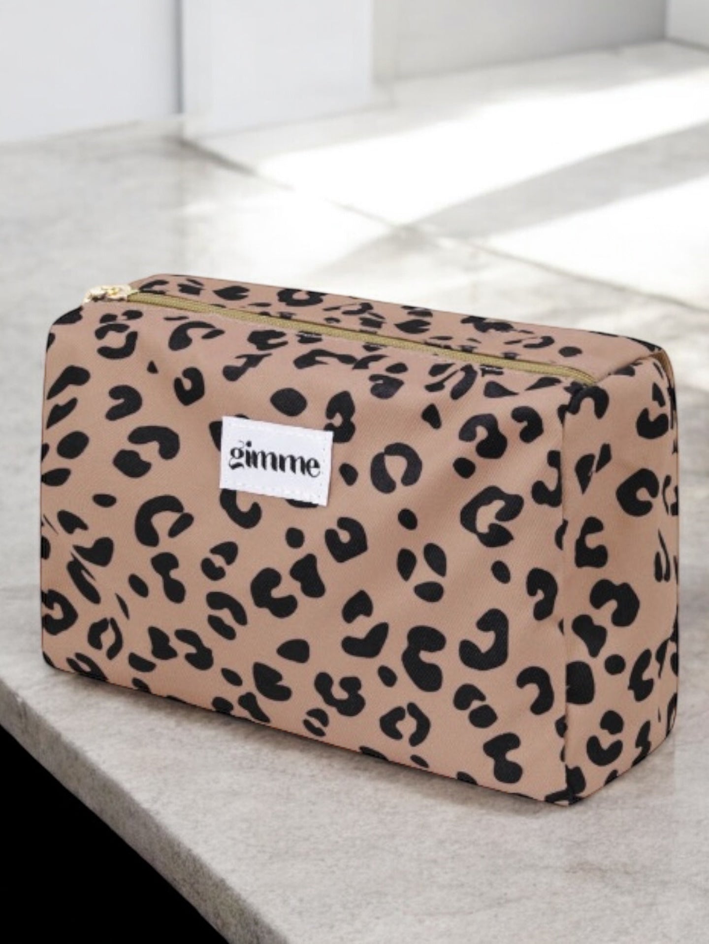 Pochette trousse en tissu imperméable marron motif léopard