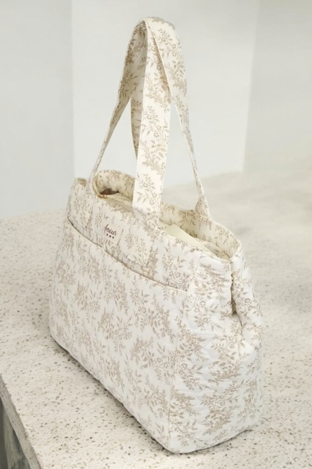 Sac week-end de voyage polochon écru coton design imprimé avec un motif floral taupe