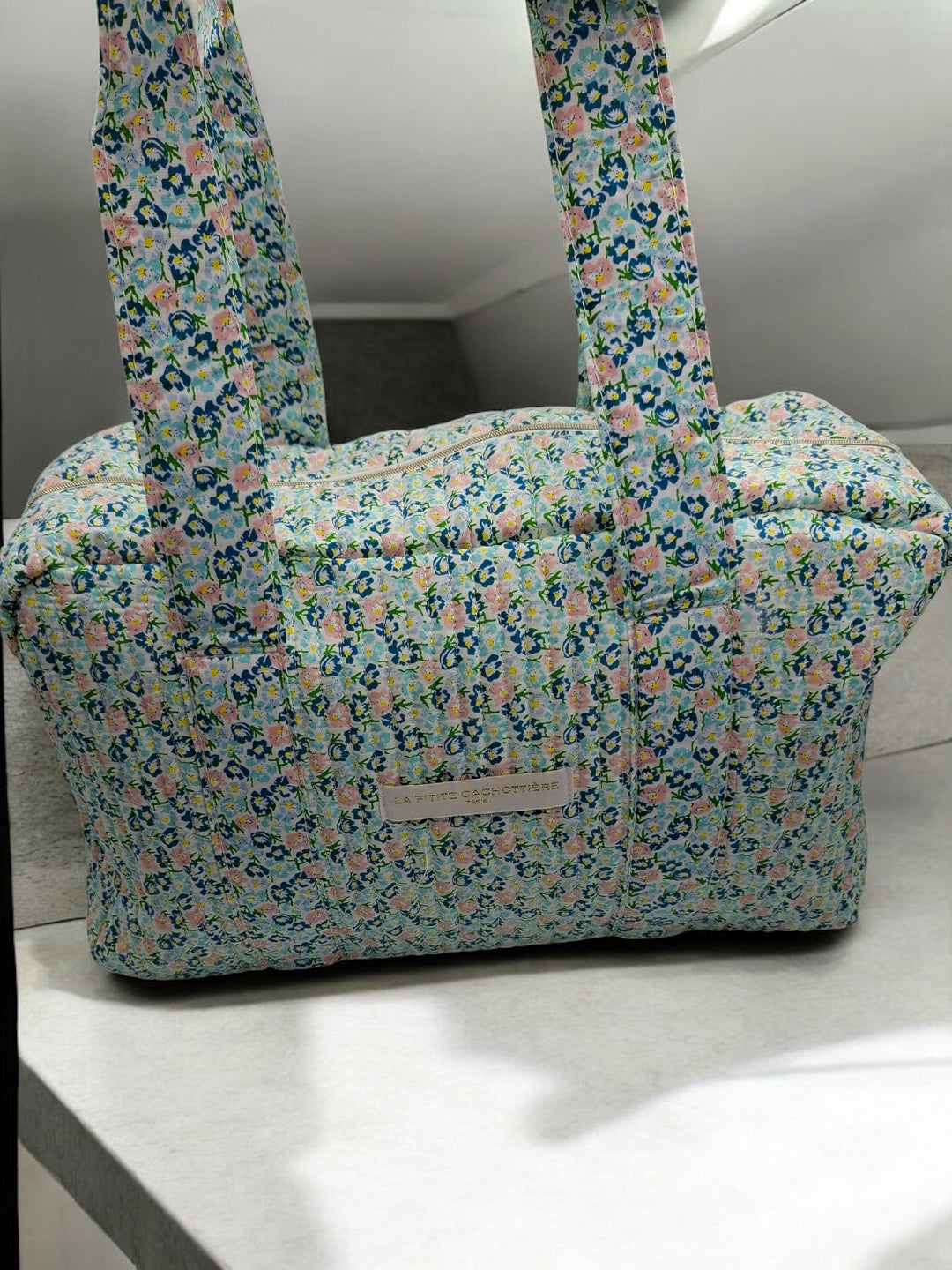 Sac week-end polochon en coton matelassé liberty fleuri bleu turquoise et touches orange