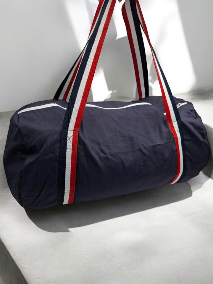 Sac polochon en tissu coton léger bleu marine détails rayés tricolores