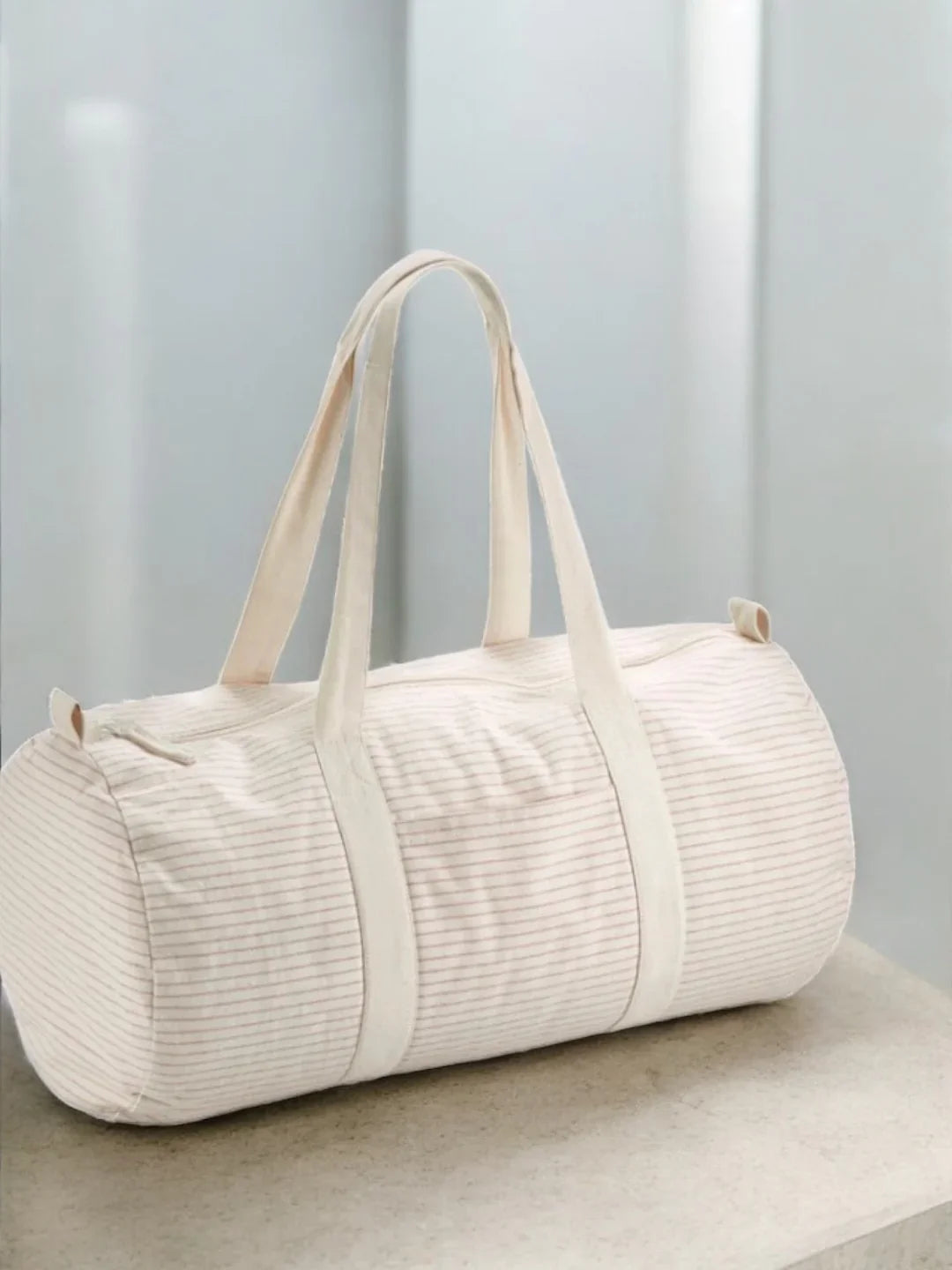 Sac polochon week end de voyage en coton léger rayé beige rouge rose