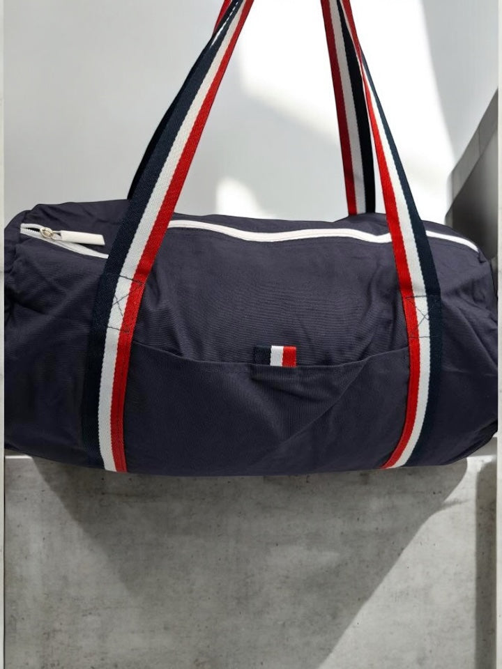Sac polochon en tissu coton léger bleu marine détails rayés tricolores