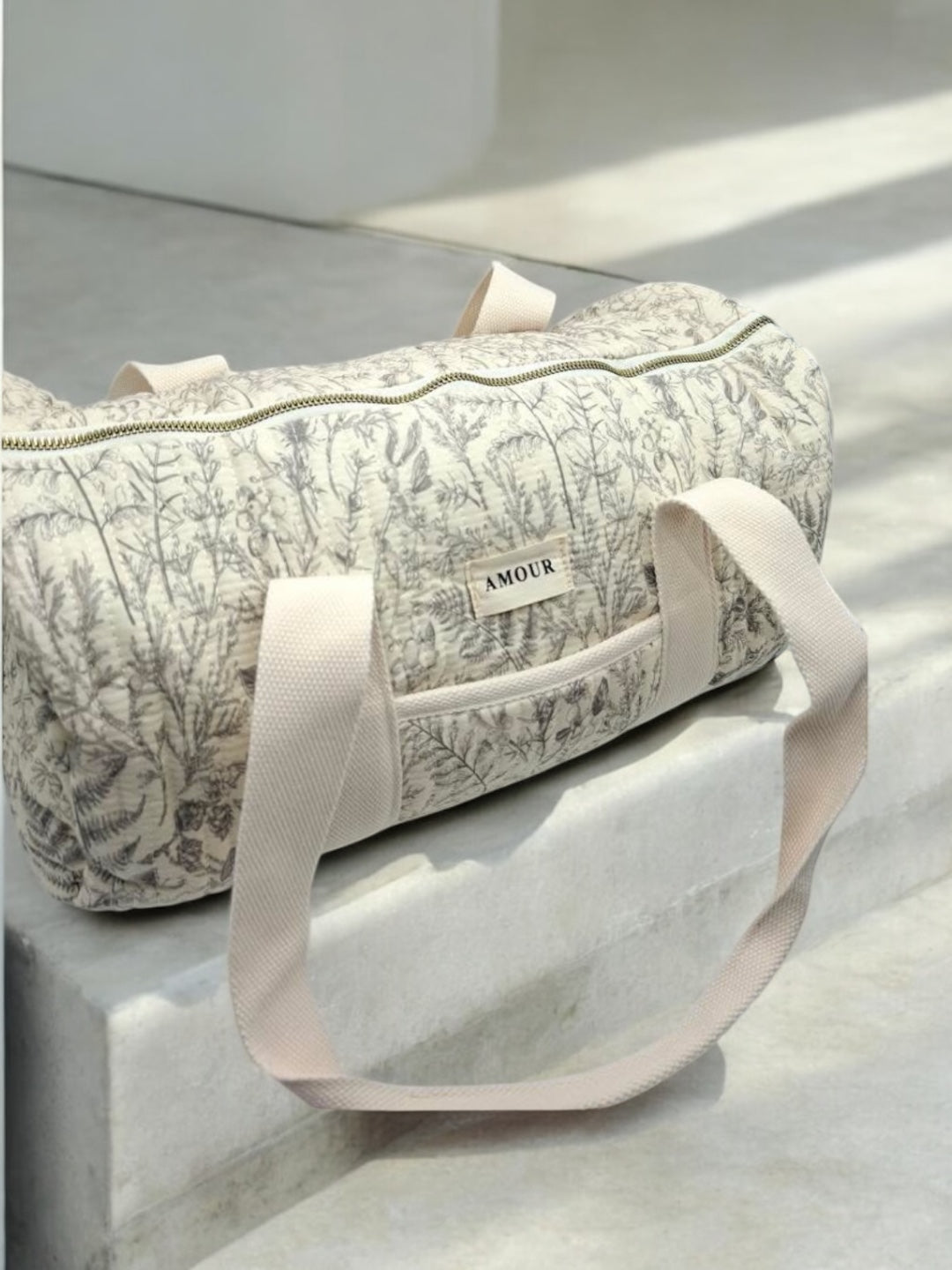 Sac polochon blanc en coton liberty fleuri noir
