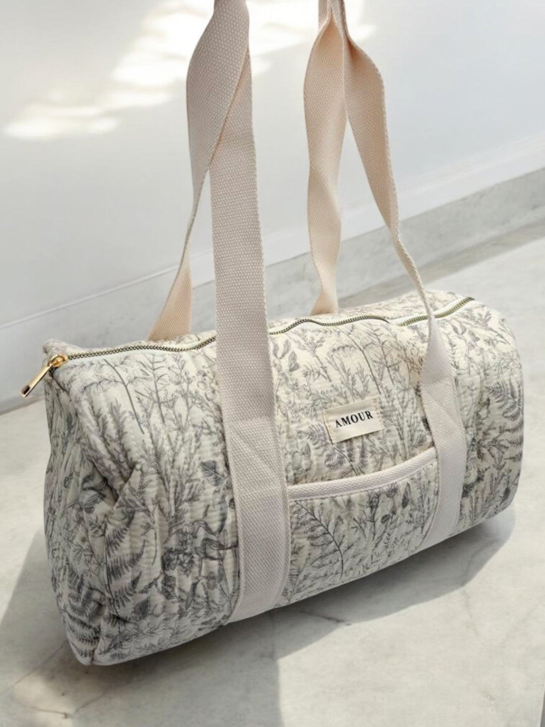 Sac polochon blanc en coton liberty fleuri noir
