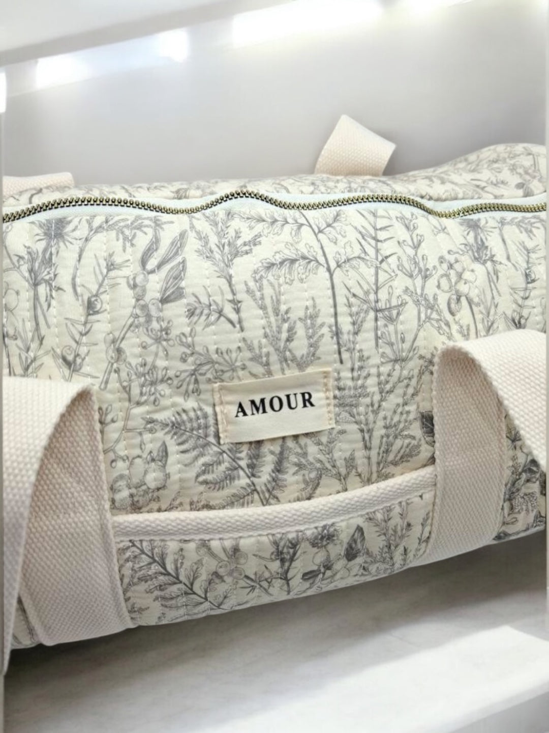 Sac polochon blanc en coton liberty fleuri noir