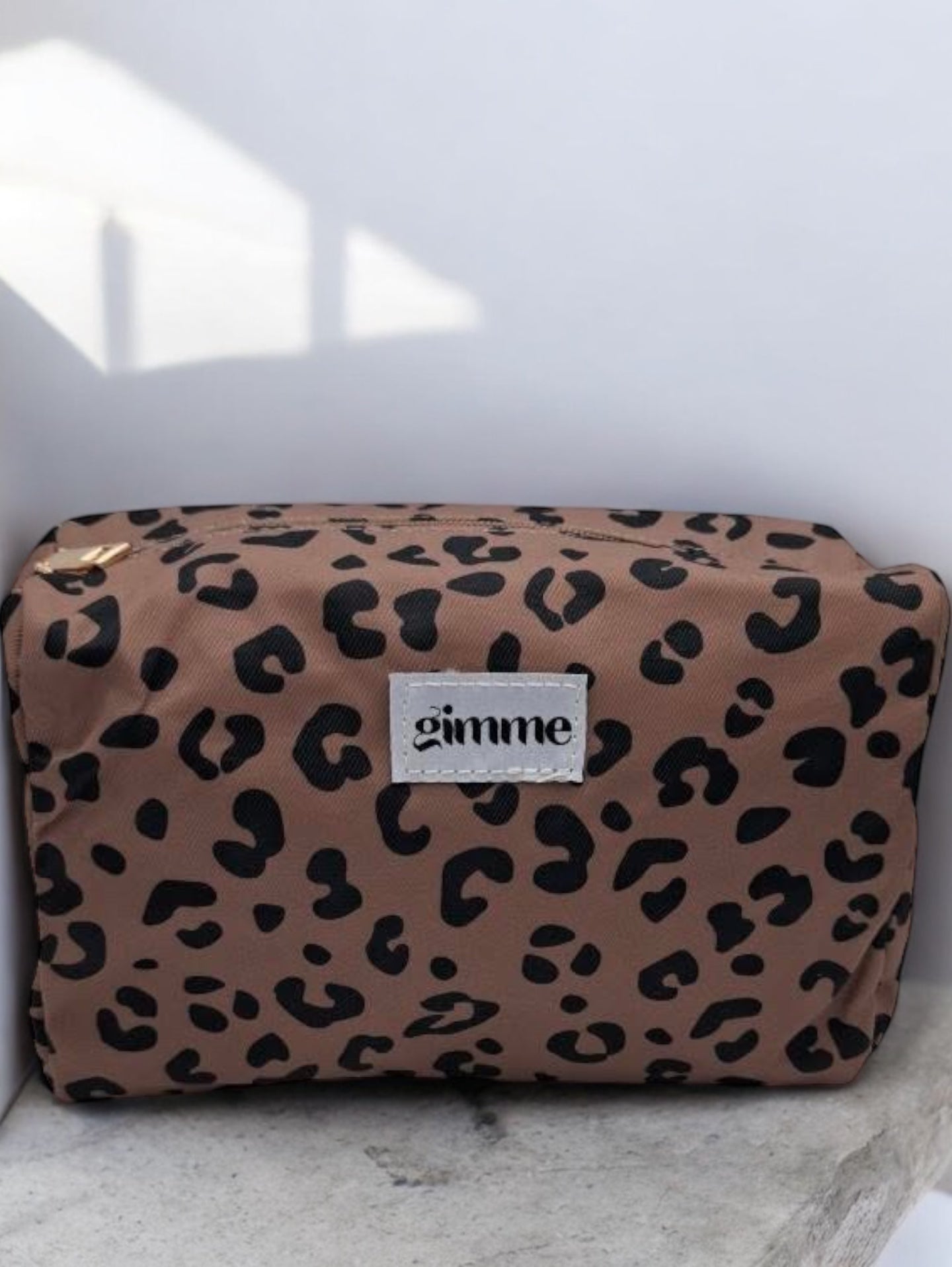 Pochette trousse en tissu imperméable marron motif léopard