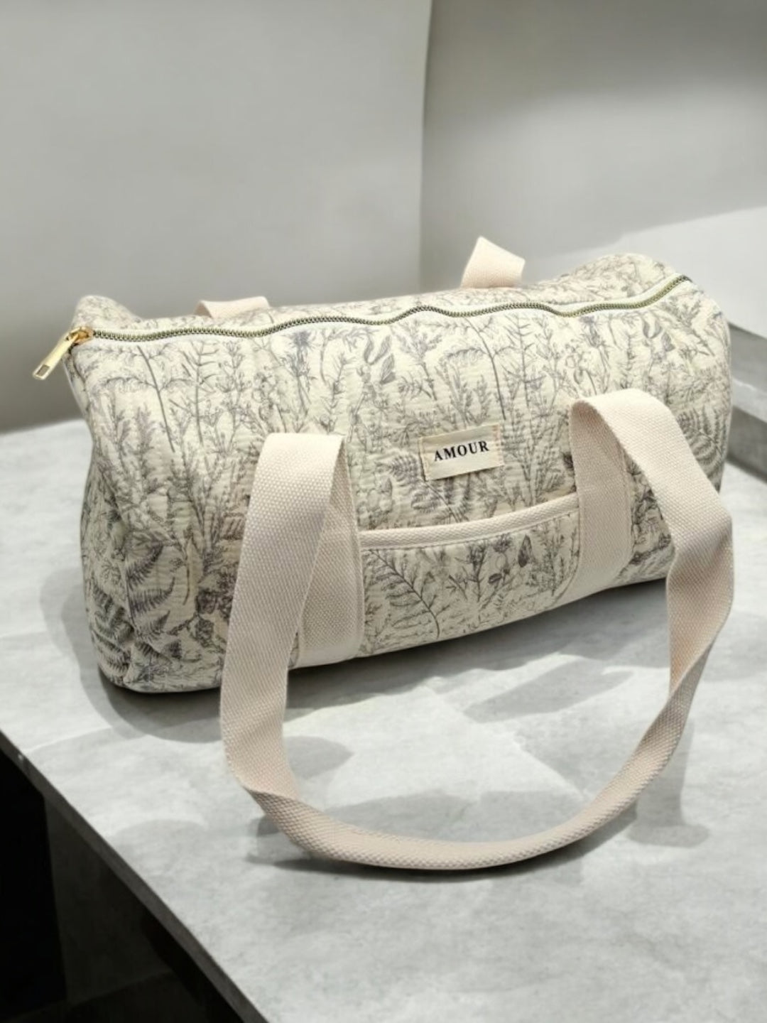 Sac polochon blanc en coton liberty fleuri noir