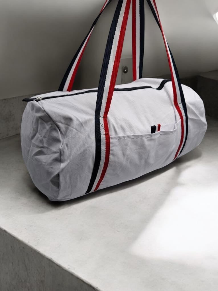 Sac polochon en tissu coton blanc détails rayés tricolores