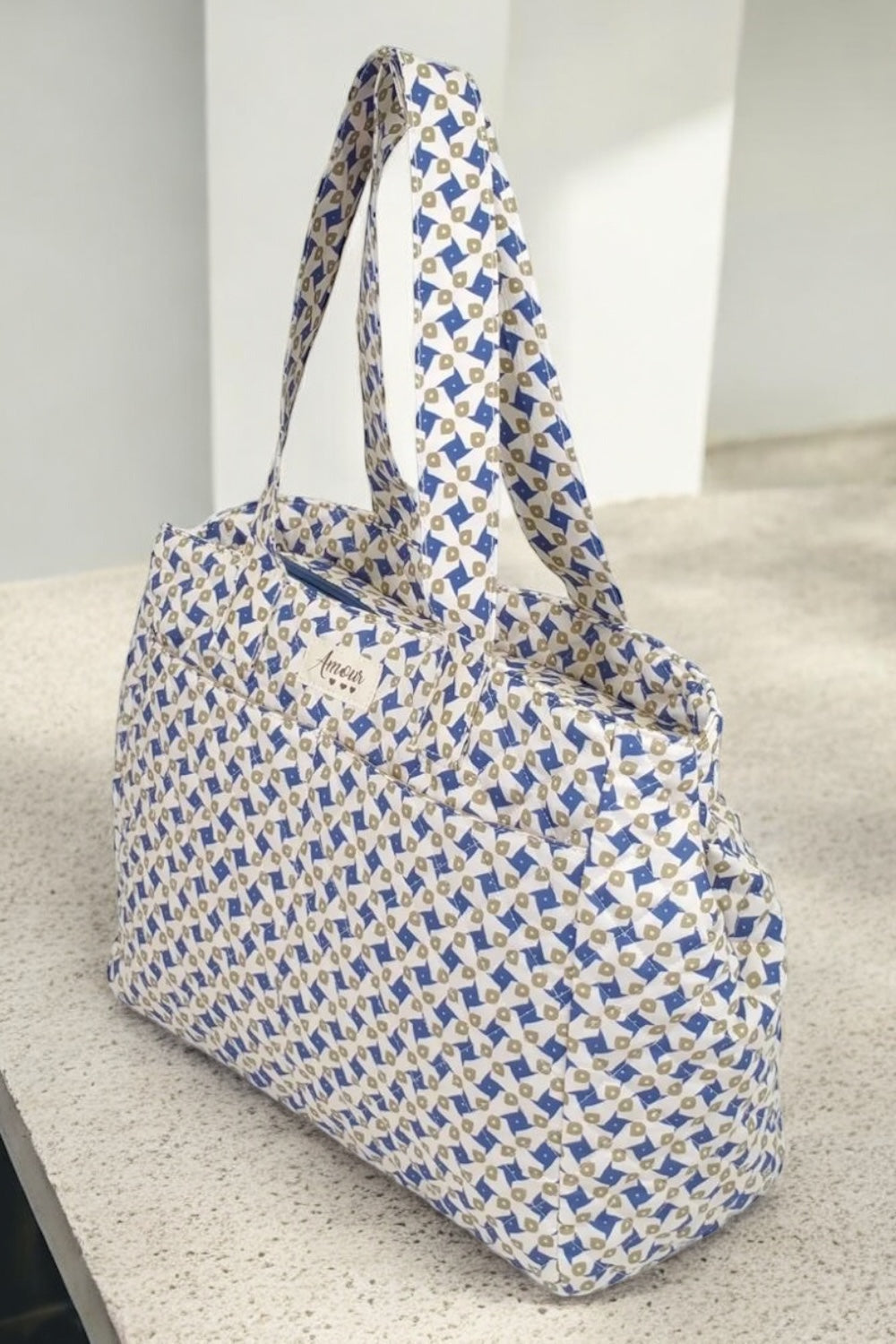 Sac week-end de voyage polochon coton design imprimé avec un motif géométrique bleu et beige