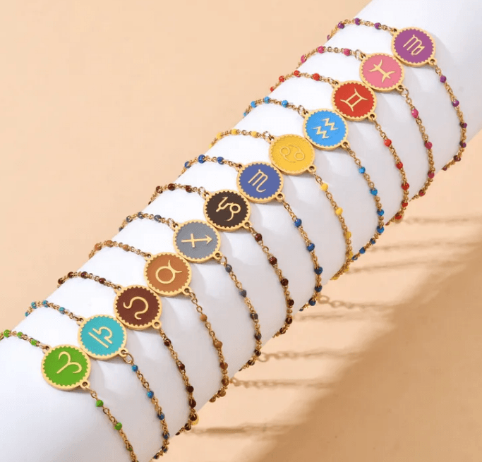 Colorful zodiac sign bracelets with gold chains, trendy jewelry at Le Petit Placard