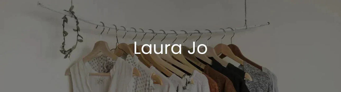 Laura Jo clothing on wooden hangers, minimalist wardrobe, Le Petit Placard fashion.
