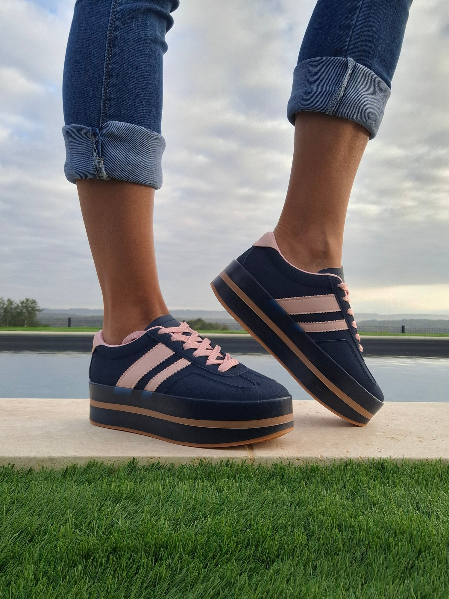 Gray sneakers with white stripes and gum sole, styled with blue jeans, Le Petit Placard