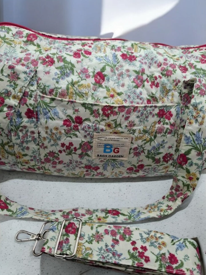 Nouveautés - Sac polochon en coton matelassé motifs à fleurs fuschia