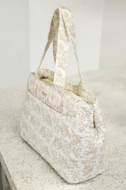 Sac week-end de voyage polochon écru coton design imprimé avec un motif floral taupe