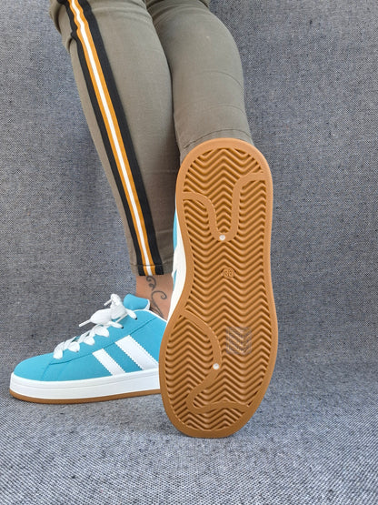 Chaussures baskets basses bleu turquoise avec bandes blanches style campus
