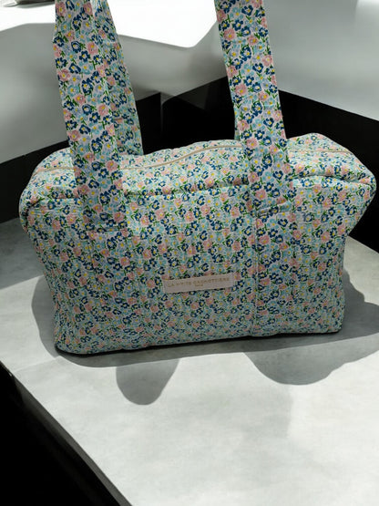 Sac week-end polochon en coton matelassé liberty fleuri bleu turquoise et touches orange