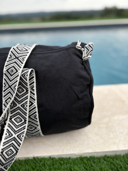 Sac polochon en coton tissu noir avec poignées motifs géométriques en noir et blanc