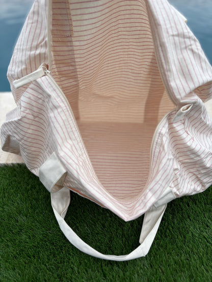 Sac polochon week end de voyage en coton léger rayé beige rouge rose