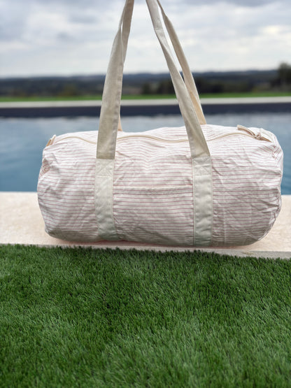 Sac polochon week end de voyage en coton léger rayé beige rouge rose