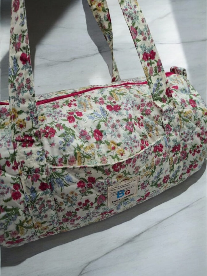 Nouveautés - Sac polochon en coton matelassé motifs à fleurs fuschia