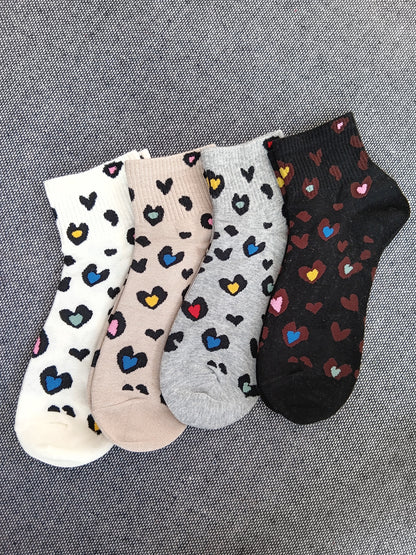 Paire de chaussettes noires en coton à motis coeurs colorés