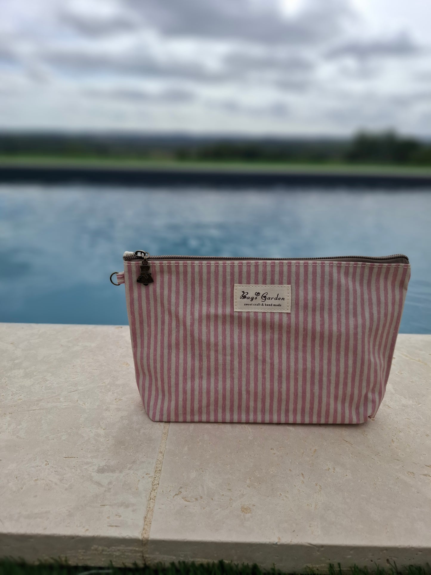 Pochette trousse en tissu imperméabilisé rose et blanc