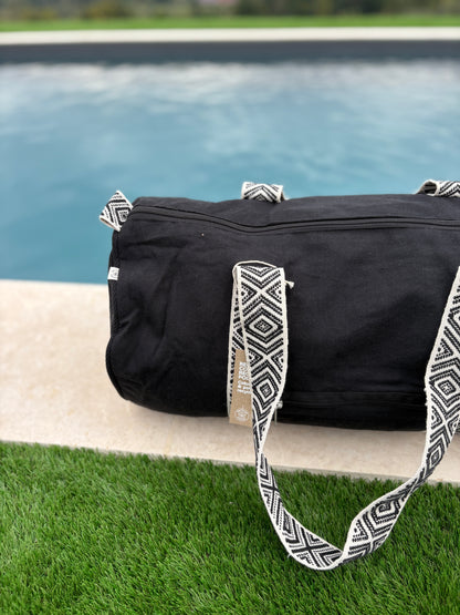 Sac polochon en coton tissu noir avec poignées motifs géométriques en noir et blanc