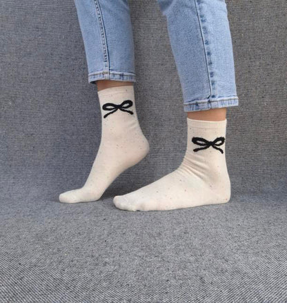 Paire de chaussettes beige en coton à motif noeud