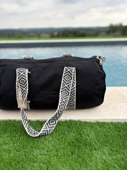 Sac polochon en coton tissu noir avec poignées motifs géométriques en noir et blanc