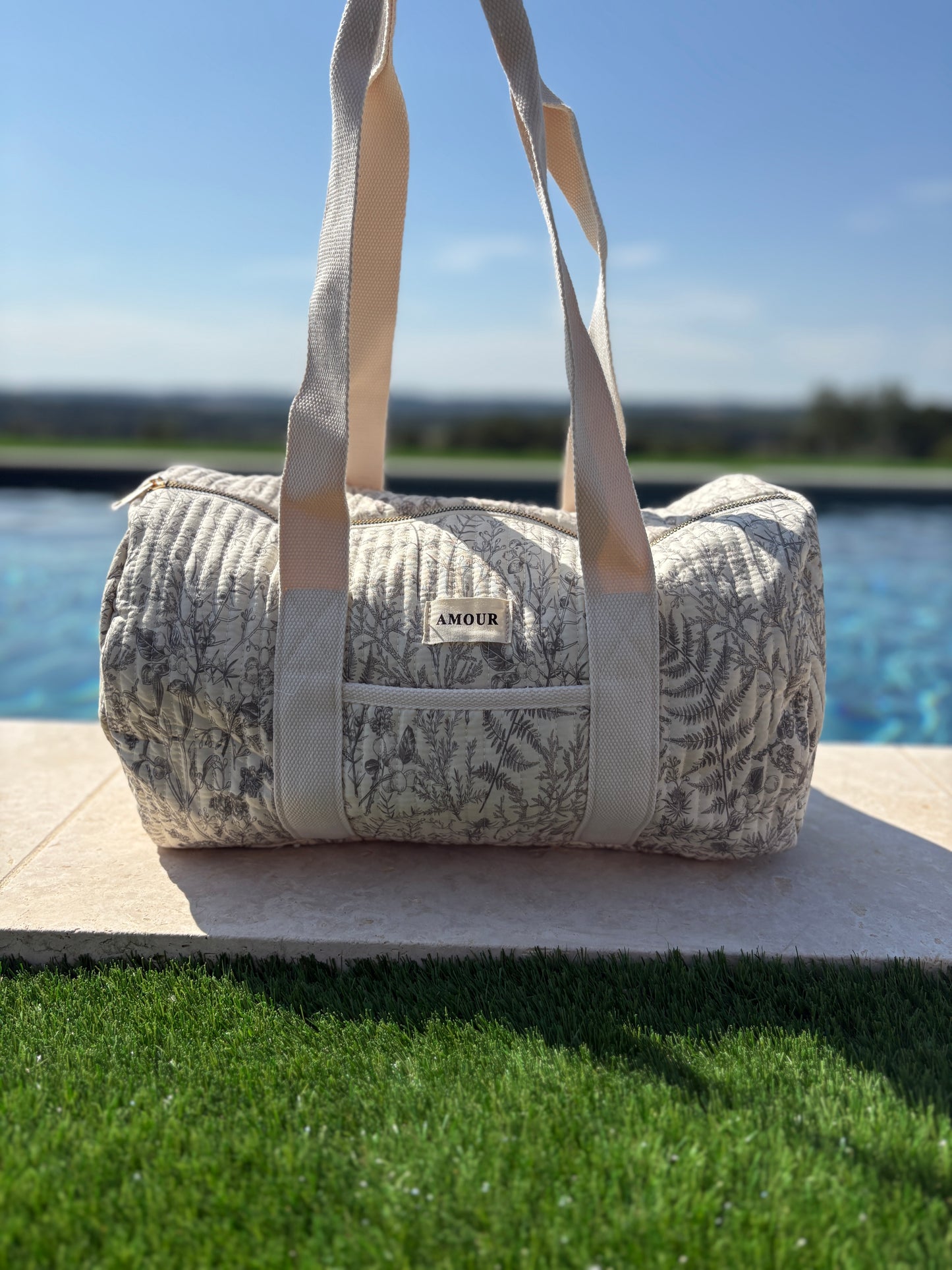 Sac polochon blanc en coton liberty fleuri noir