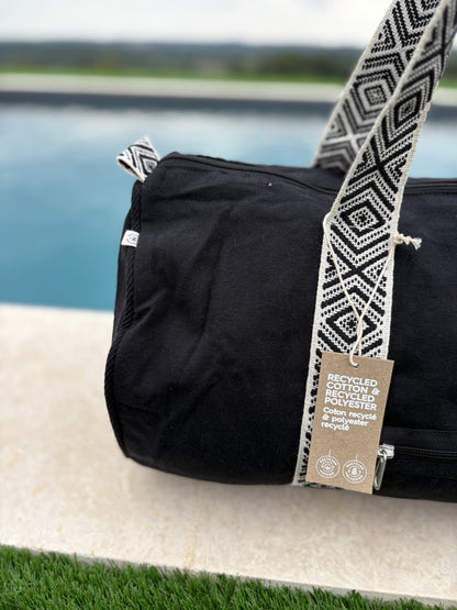 Sac polochon en coton tissu noir avec poignées motifs géométriques en noir et blanc