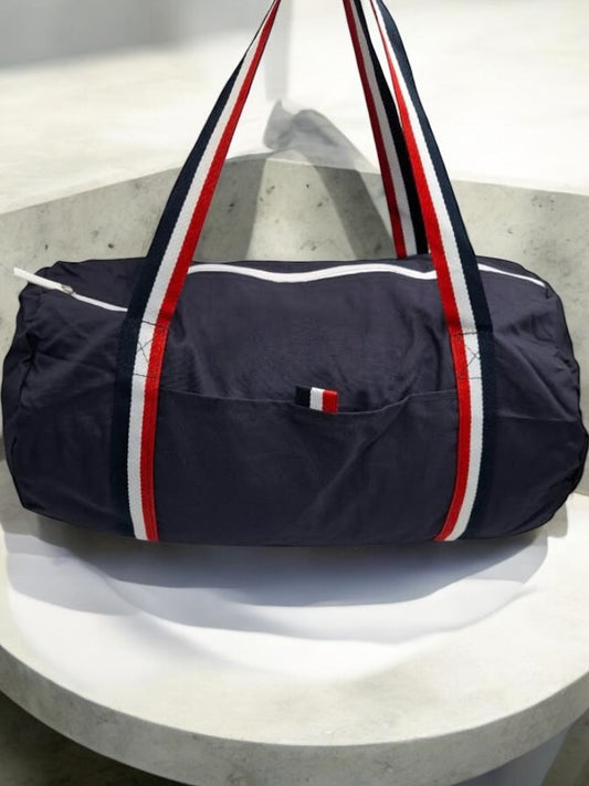 Sac polochon en tissu coton léger bleu marine détails rayés tricolores