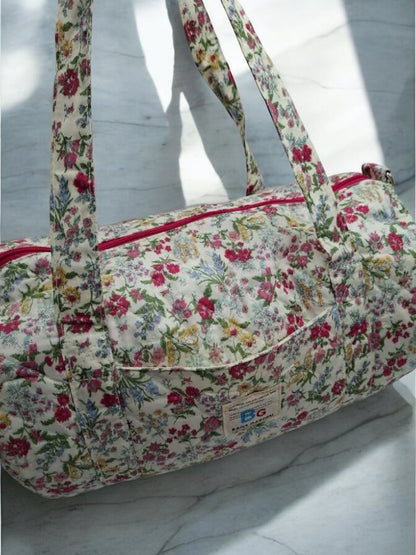 Nouveautés - Sac polochon en coton matelassé motifs à fleurs fuschia