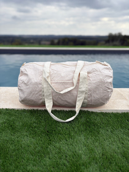 Sac polochon week end de voyage en coton léger rayé beige rouge rose