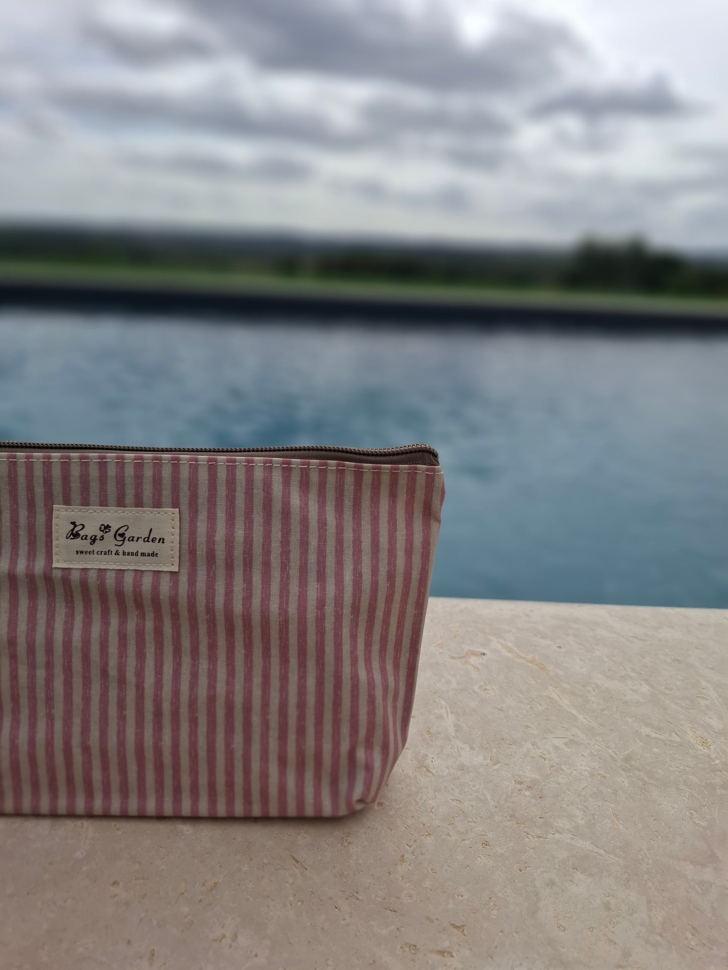 Pochette trousse en tissu imperméabilisé rose et blanc