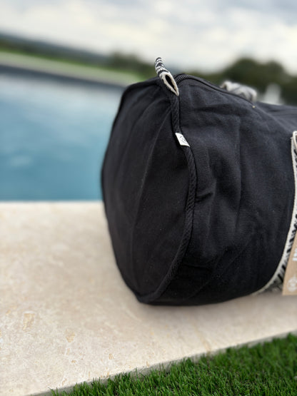 Sac polochon en coton tissu noir avec poignées motifs géométriques en noir et blanc