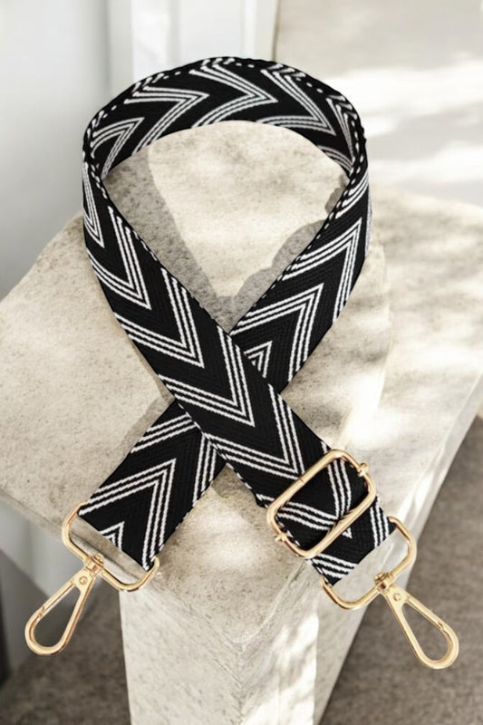 Bandoulière sangle large chevrons noir à motif blanc mousquetons dorés