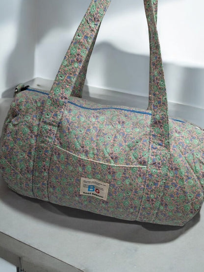 Nouveautés - Sac polochon en coton matelassé motifs à fleurs parme