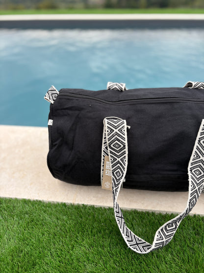 Sac polochon en coton tissu noir avec poignées motifs géométriques en noir et blanc