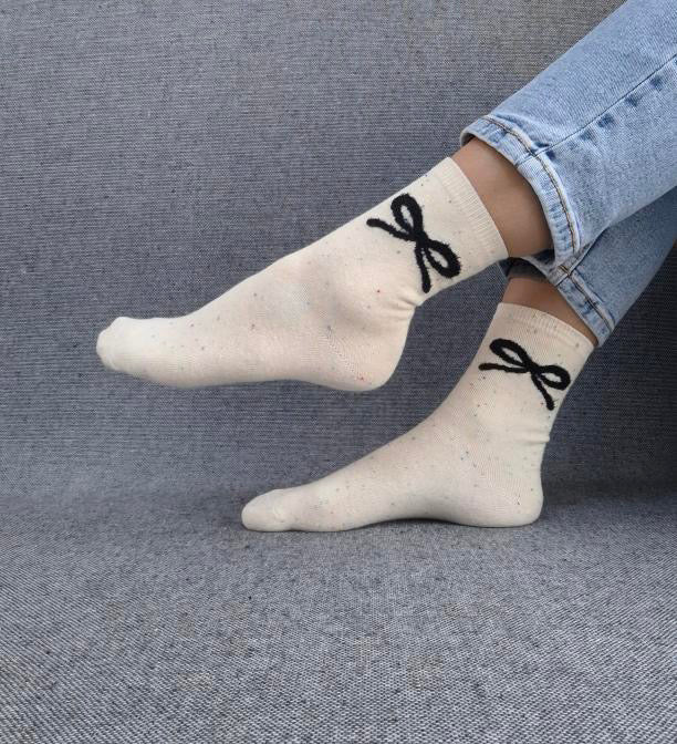 Paire de chaussettes beige en coton à motif noeud