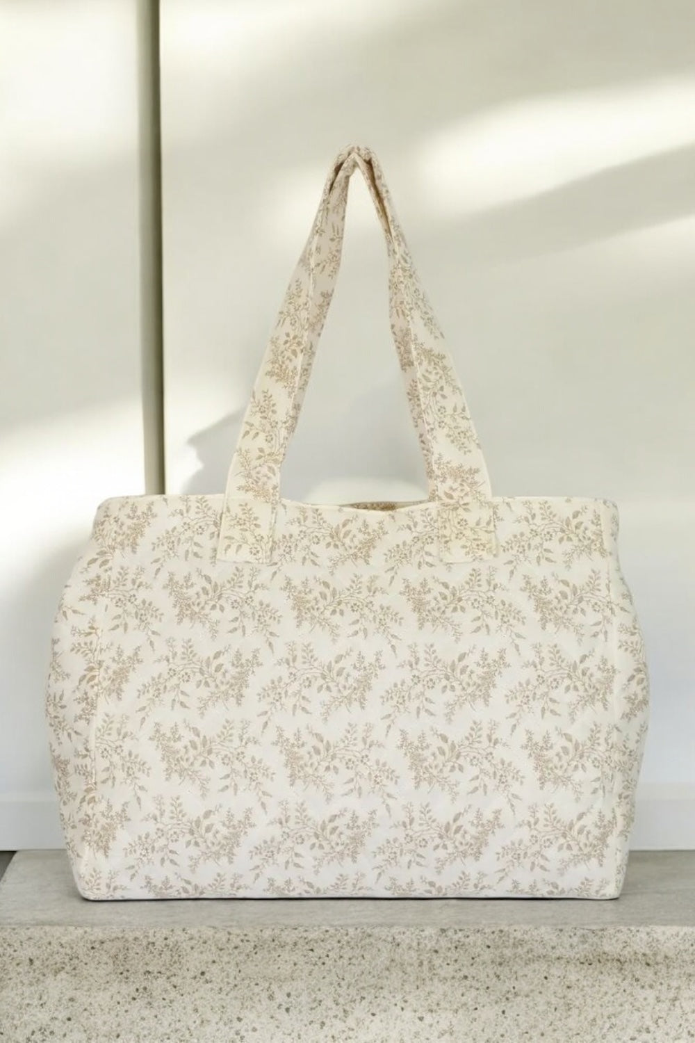 Sac week-end de voyage polochon écru coton design imprimé avec un motif floral taupe