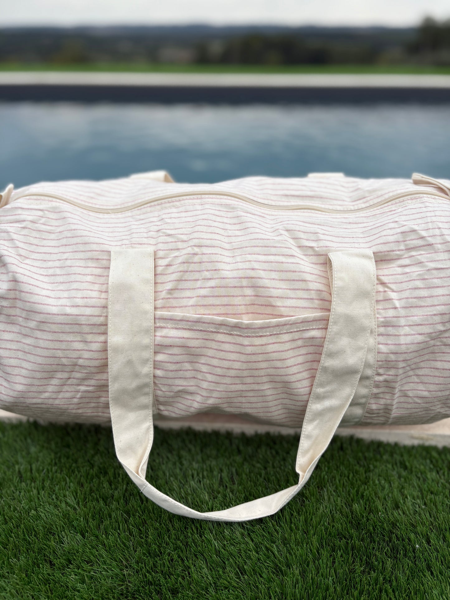 Sac polochon week end de voyage en coton léger rayé beige rouge rose