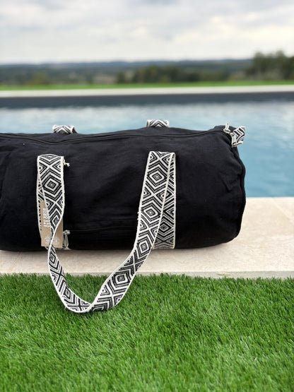 Sac polochon en coton tissu noir avec poignées motifs géométriques en noir et blanc