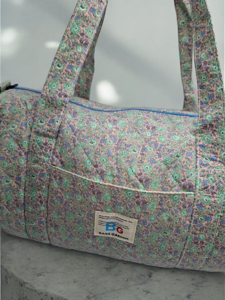 Nouveautés - Sac polochon en coton matelassé motifs à fleurs parme