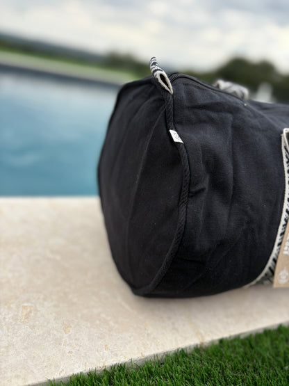 Sac polochon en coton tissu noir avec poignées motifs géométriques en noir et blanc