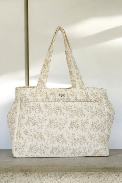 Sac week-end de voyage polochon écru coton design imprimé avec un motif floral taupe