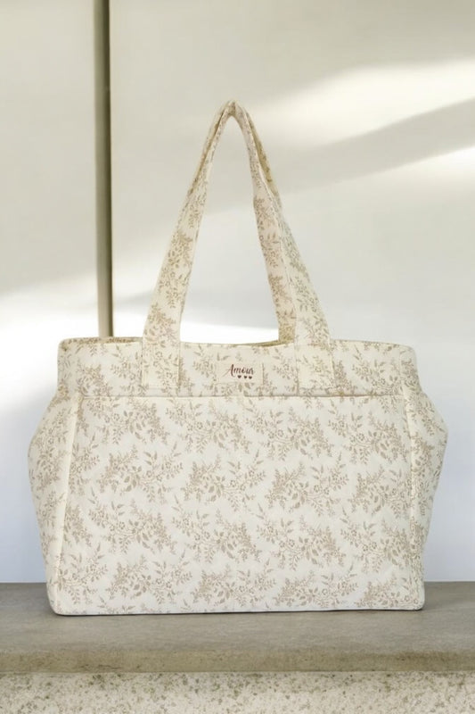 Sac week-end de voyage polochon écru coton design imprimé avec un motif floral taupe