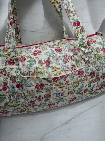 Nouveautés - Sac polochon en coton matelassé motifs à fleurs fuschia