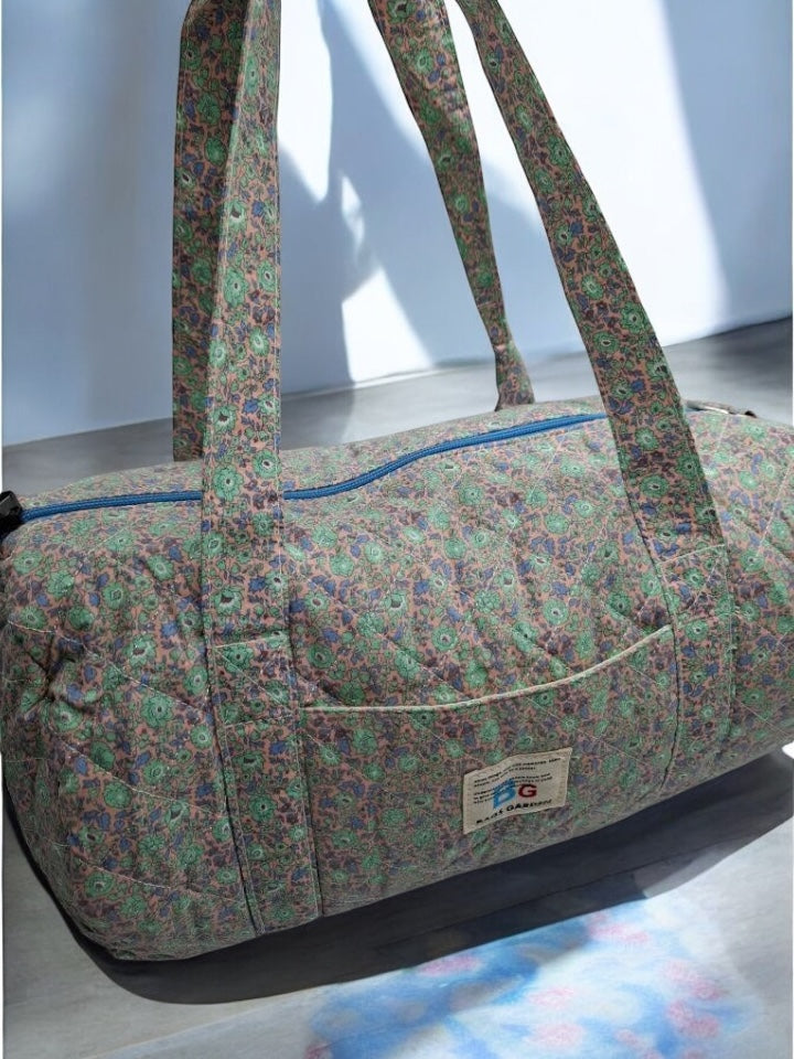 Nouveautés - Sac polochon en coton matelassé motifs à fleurs parme