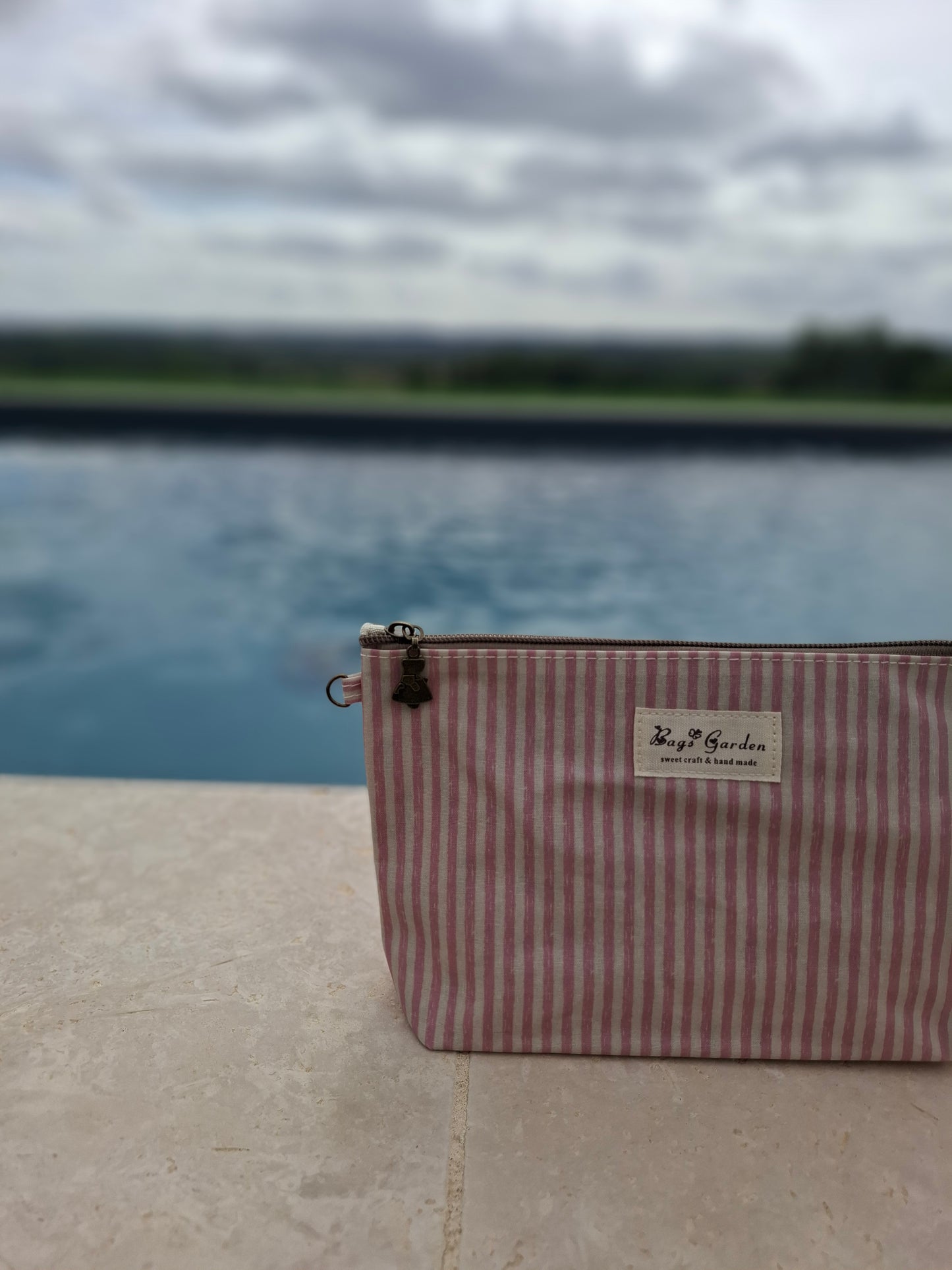 Pochette trousse en tissu imperméabilisé rose et blanc